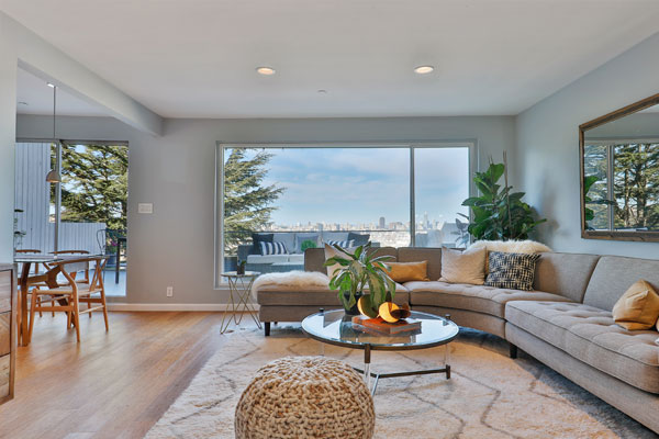 Photo of staged living room with views and deck